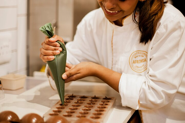 Immerse yourself in the sweet world of chocolate making where expert chocolatiers guide you through crafting exquisite treats blending flavors and discovering the essence of African cocoa.